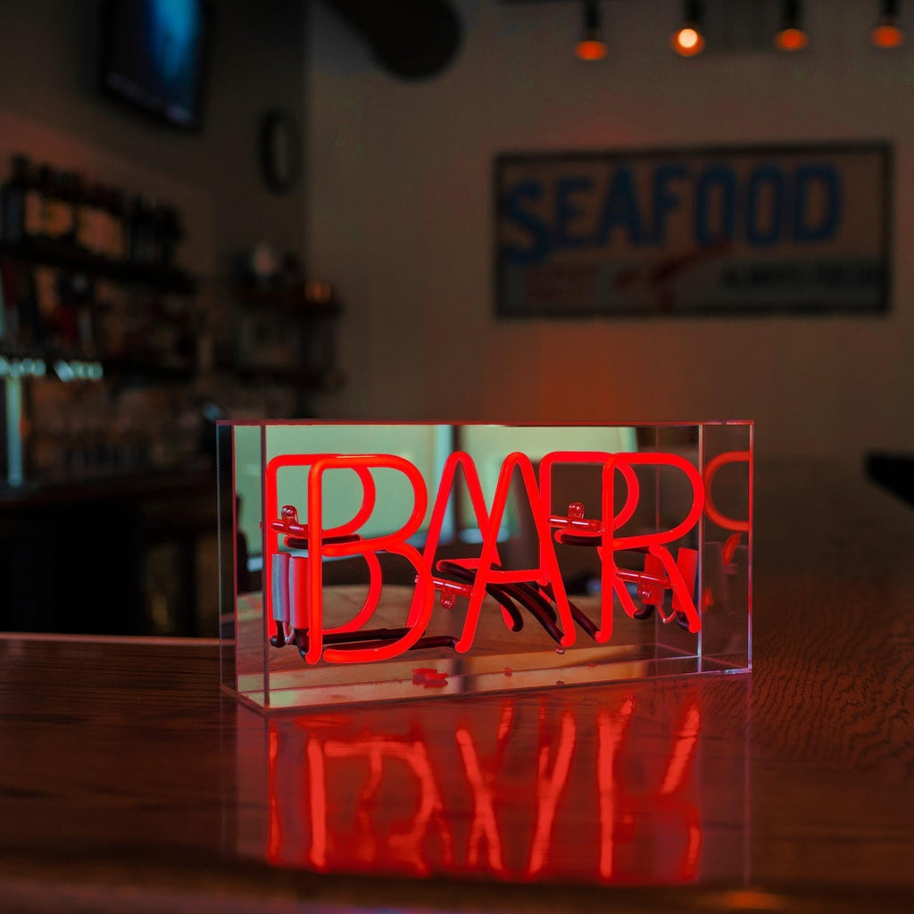 Insegna al neon "BAR" rossa